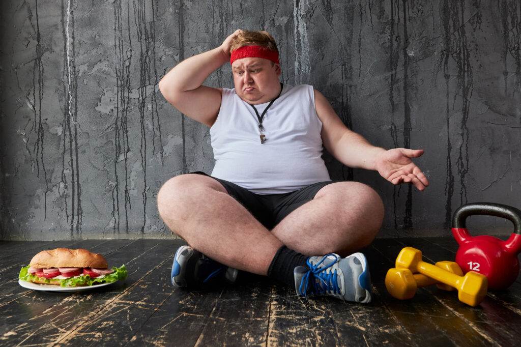 A troubled man not able to lose weight and struggling with food