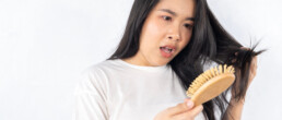 A woman shocked to see hair loss