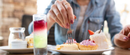 Woman eating sweets at a restaurant