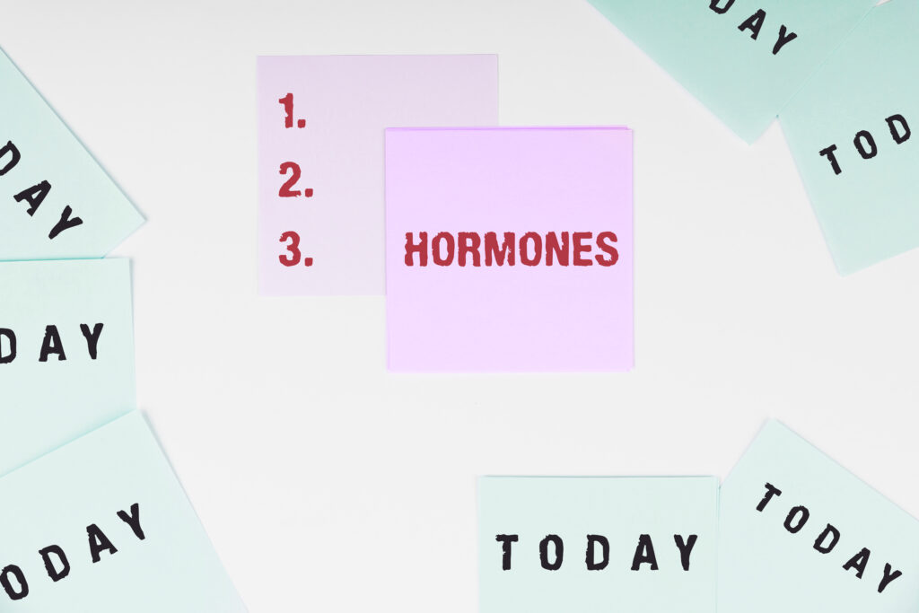 Sticky notes on a white background, with one pink note reading "HORMONES" and another showing a numbered list (1, 2, 3), surrounded by light green notes labeled "TODAY".